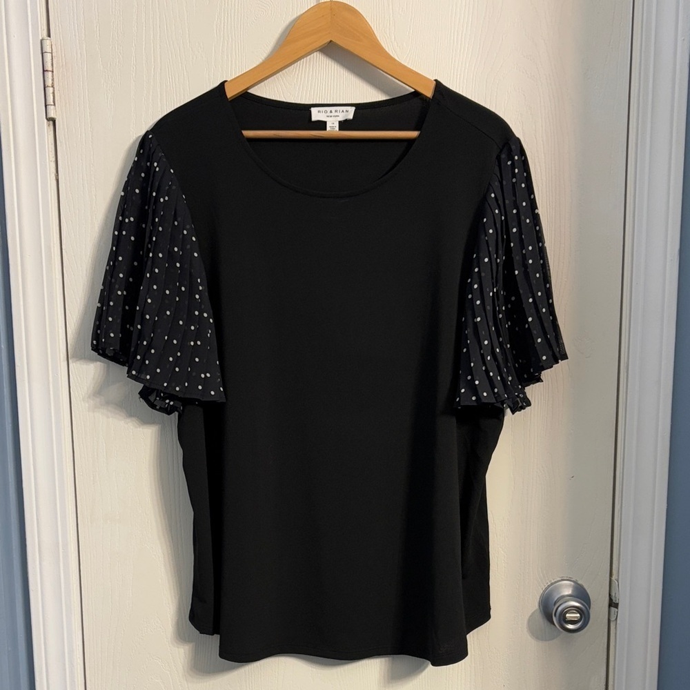 Chic Black Blouse with Polka Dot Sleeves